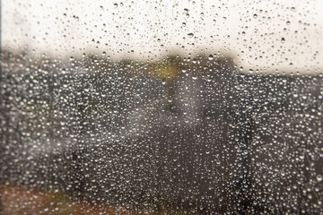 Rain or snow drops on the window. Rainy weather 