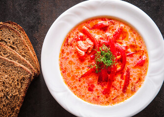 Homemade red beetroot soup. Traditional Ukrainian borscht with sour cream