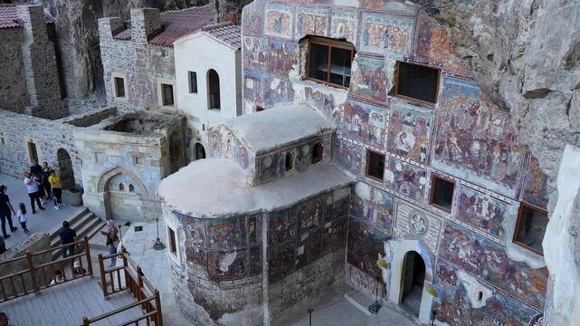 Sumela monastery courtyard under the rock. Remains of old fresco are seen on several walls.Macka, Trabzon, Turkey.