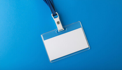 Blank office badge, empty name tag on bright blue backdrop. Mock-up.