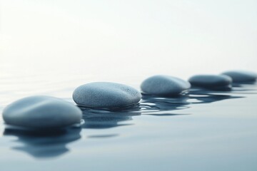 a row of rocks sitting on top of a body of water
