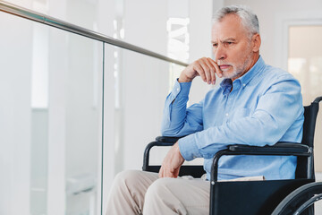 Thoughtful senior man sitting on wheelchair at hospital