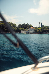 House in small Croatian town in summer by bright blue sea, near Dubrovnik