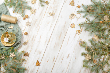 Top view Christmas background. Fir tree branches on white vintage wood decorated for x-mas. Place for text. Twig green spruce. Copy space border. Christmas banner in rustic natural style.Greating card