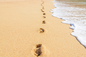 Footprints on the beautiful ocean sand. Set of pictures showing ocean waves in different stages...
