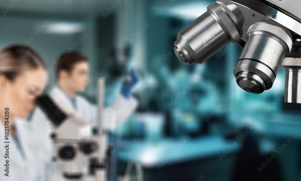 Poster double exposure of microscope and scientist using equipment .