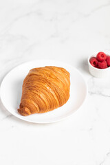 freshly baked golden French croissant