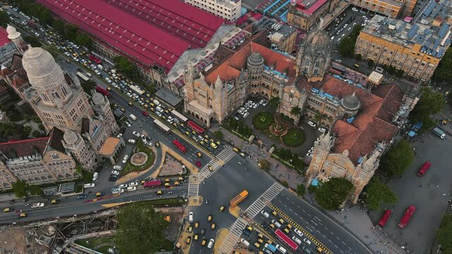 Chhatrapati Shivaji Terminus (CSTM) is a historic railway station in Mumbai, Maharashtra, India, with a wide-angle shot of the busy road intersection in front of the site