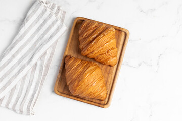 freshly baked golden french croissants