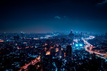 Fototapeta premium The vibrant city lights glow brightly at night as traffic flows along the streets beneath a dark sky