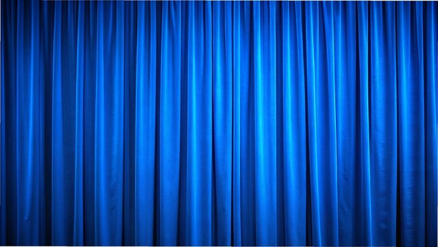 Close-up of a blue curtain with vertical folds, spotlighted in a theater setting, showcasing rich blackout fabric texture.