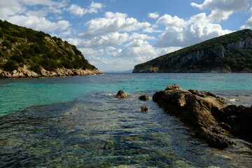 serene view of an ocean bay with turquoise water in sardinia, italy