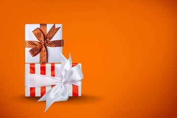 Beautiful colored gift and present with ribbon bow