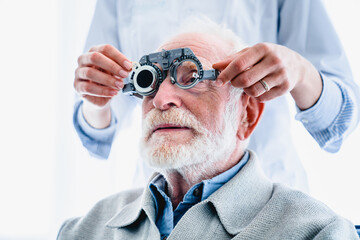 Close up photo of mature male patient wearing special ophthalmic glasses