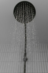 Luxury Shower head pouring water in modern bathroom abstract shower