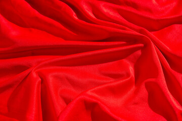 focus on red luxury fabric texture or Silk Fabric texture background. Abstract. Seamless background. Seamless fabric pattern. Silk background for valentine's day, christmas.