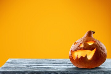 Scary pumpkin for halloween party on the desk