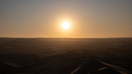 Immense Dune Landscape by the City of Ica, Peru at Sunset Facing the Sun Dramatically