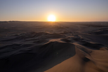 Immense Dune Landscape by the City of Ica, Peru at Sunset Facing the Sun Dramatically