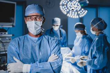 Senior experienced male doctor in surgical uniform.