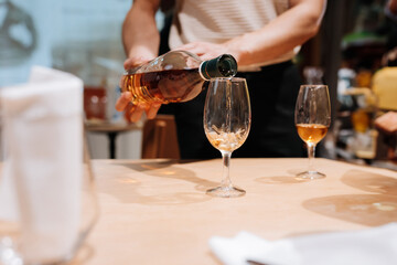 Pouring premium whiskey into glasses at a tasting event, Luxury, celebration, and social gatherings