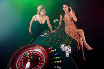 Photo of chic attractive ladies bachelorette enjoy friday night weekend in vegas casino for winning...