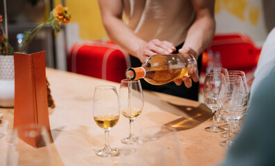 Pouring premium whiskey into glasses during luxury tasting event, perfect for high-end experiences