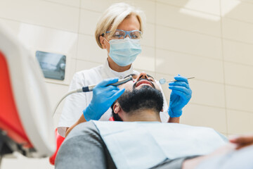 Low angle view photo of a stomatology hospital clinic. Client patient visiting dentist...