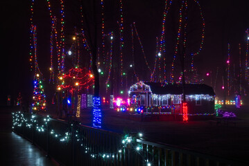 An extensive Christmas lighting display in a northeast Ohio city park viewed from a pedestrian bridge