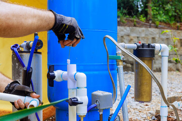 Assembly of connection service for water well to house water system by plumber
