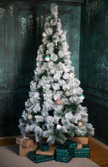 christmas decorations and tree in a living room