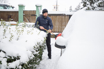 snow shoveling in winter after blizard