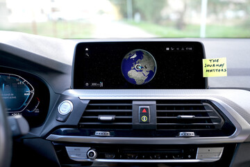 THE journey matters, a post-it on the board of a car.