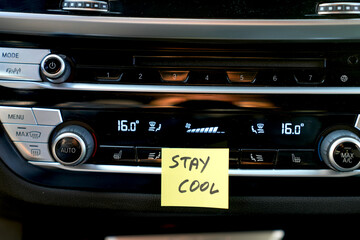 stay cool, a post-it next to the car's air conditioner that says stay cool