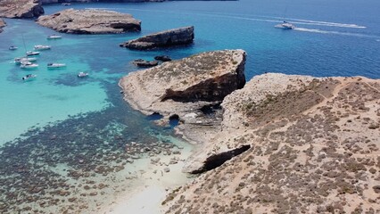 Beautiful white sand beach on Uninhabited Cominotto island, Comino, Malta. Aerial shot. High quality photo