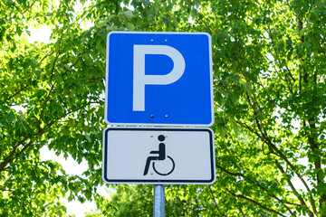 Disabled parking signs in city, closeup