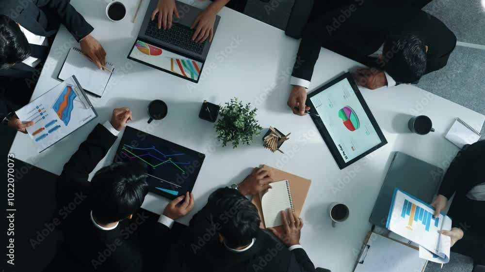 Poster top view of smart marketing team analyze financial statistic graph and stock market chart from table
