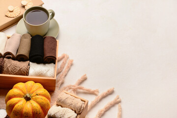 Basic color socks with pumpkin, accessories and cup of tea on white background