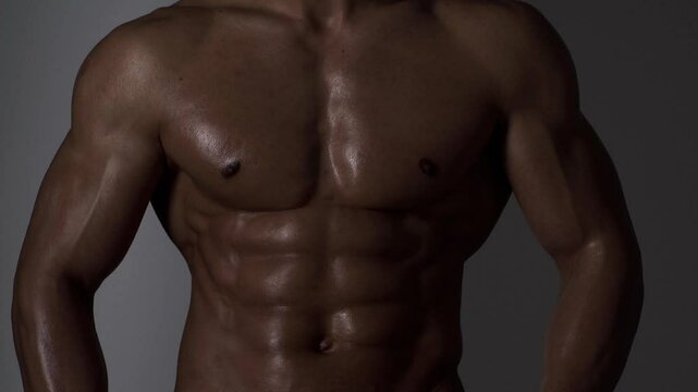 Male chest. Perfect abs, shoulders, and chest. Close up the Abs. Closeup torso. Ab. Muscular chest and ripped abs. Sexy male muscular body. Man with naked torso showing chest and six pack abs.