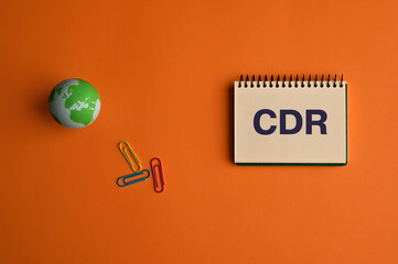 There is notebook with the word CDR. It is an abbreviation for Carbon Dioxide Removal as...