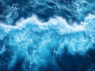 Fototapeta premium A powerful wave crashes in the deep blue ocean, creating a beautiful display of white foam and turquoise water.