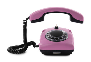 Old pink telephone with rotary dial isolated on white