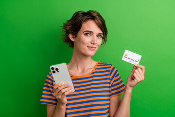 Photo portrait of pretty young girl hold credit card device ecommerce wear trendy striped outfit...