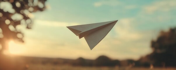 Slowmotion of a paper airplane gliding through the air, paper airplane, childhood fun