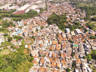 Cityscape of massive residential areas in Bandung, Indonesia. Urban skyline of the densely populated City in South East Asia. Bandung City is inhabited by 2.5 Million People. Population density.