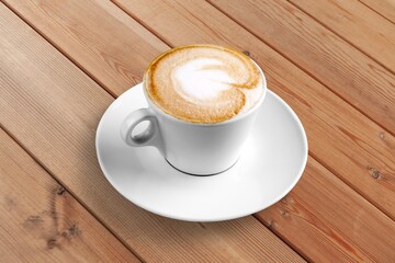 coffee drink with latte art on table in cafe