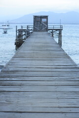 Wooden pier leading to the horizon over open waters.