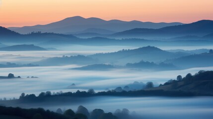Obraz premium Gentle layers of fog envelop rolling hills at dawn, creating a serene and mystical landscape under soft pastel skies.
