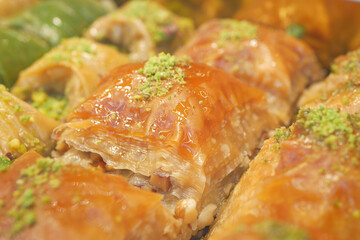 Enjoy the mouthwatering and delicious Baklava Slices that come with a delightful Pistachio Topping