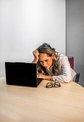 Stressed hispanic Businesswoman Facing Work Challenges on Laptop